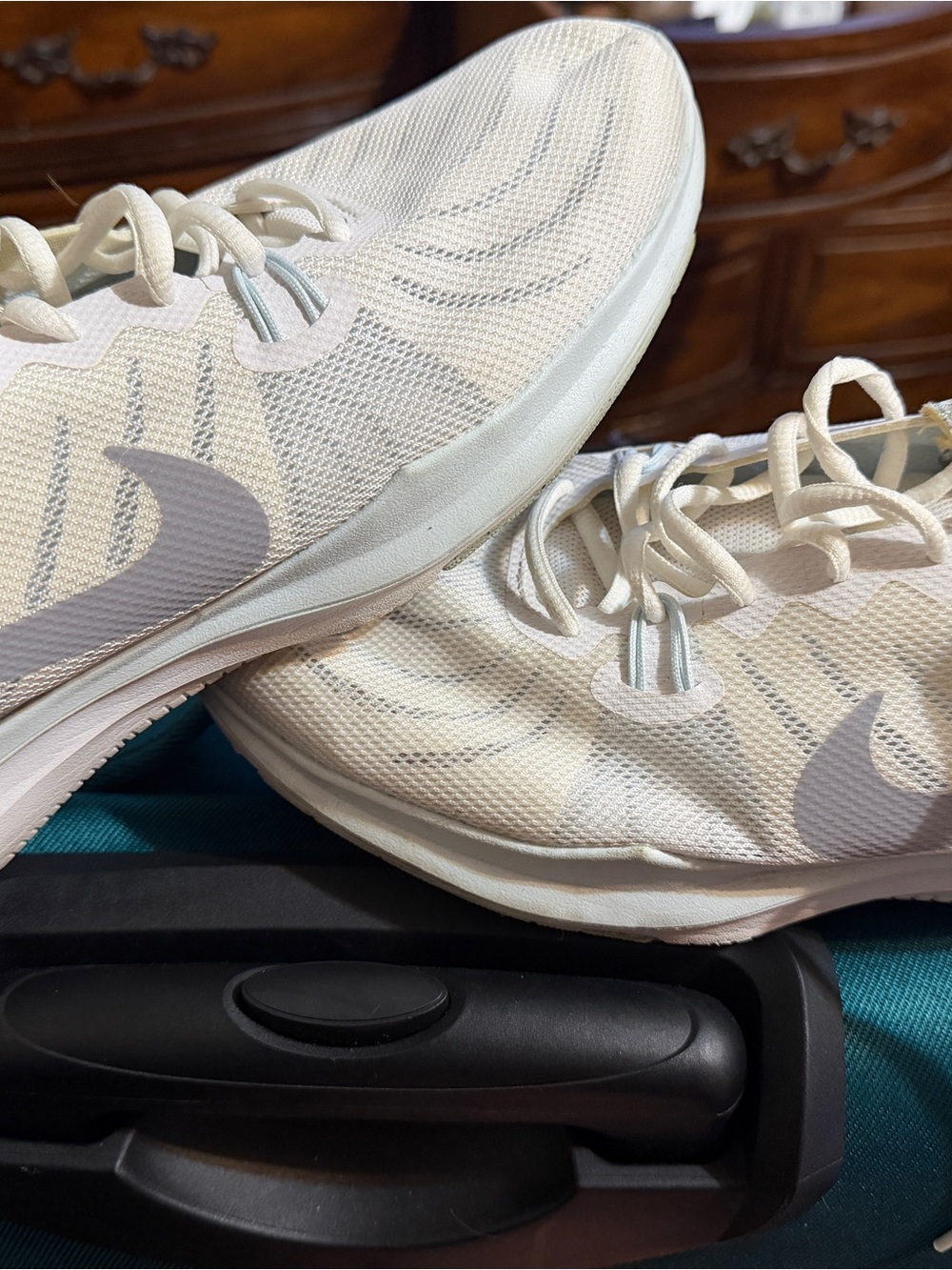 Nike Womenโs White Athletic Running Shoes with Light Gray Swoosh